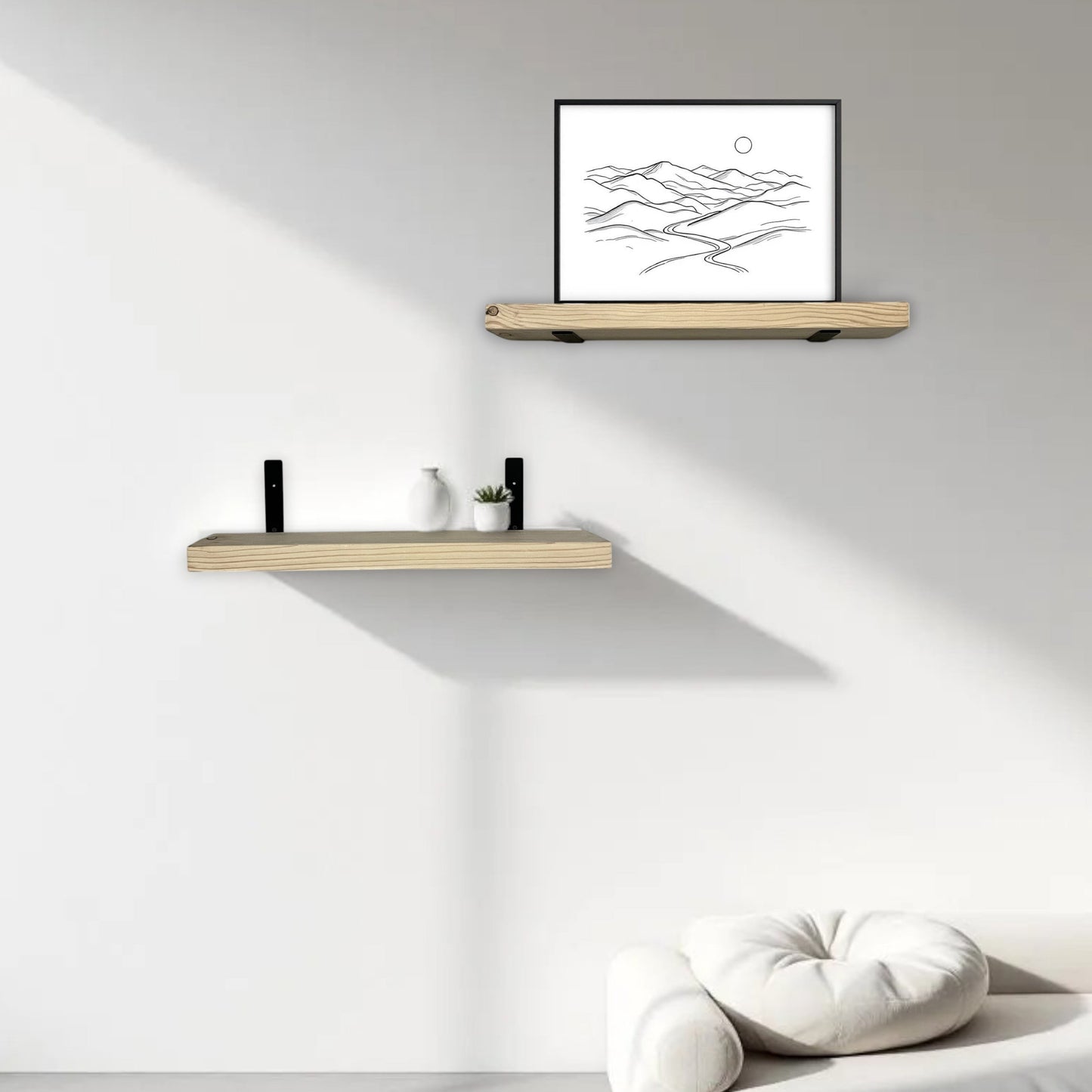 Two wooden shelves on a white wall with a framed picture and decorative items.