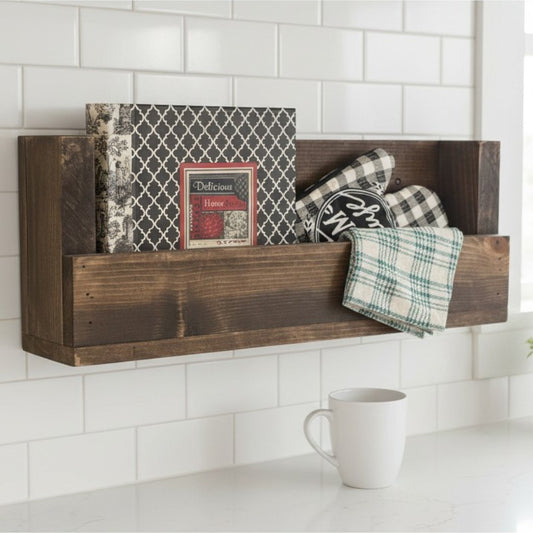 Wooden wall shelf with decorative items against a white tiled wall.