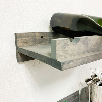 Handmade solid wood wall-mounted wine rack in dark walnut with floating shelf design, modern rustic furniture style.