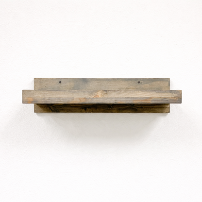 Rustic gray solid wood floating wall shelf with integrated hanging wine glass rack, handmade furniture.