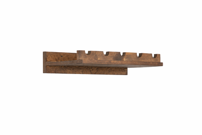 Handmade solid wood wall-mounted wine rack in dark walnut with floating shelf design, modern rustic furniture style.