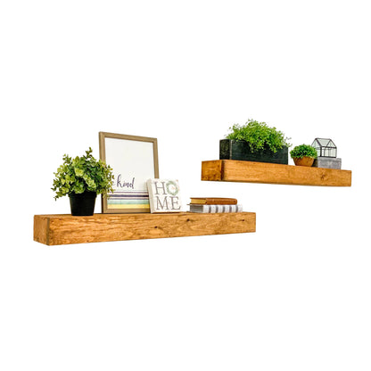 Dark walnut solid wood floating box shelves mounted above white sofa in modern rustic living room.