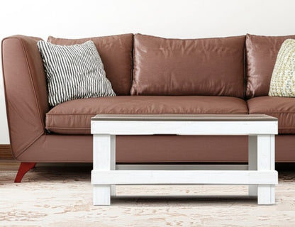 White solid wood coffee table with a plank top in modern rustic furniture style.