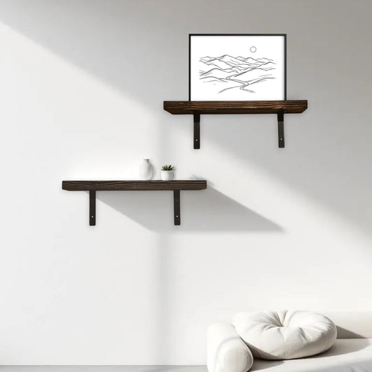 Two wooden shelves on a white wall with a framed picture above them, near a window.
