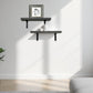 Modern living room with a white sofa, wall-mounted shelves, and a framed picture.