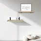 Two wooden shelves on a white wall with a framed picture and decorative items.