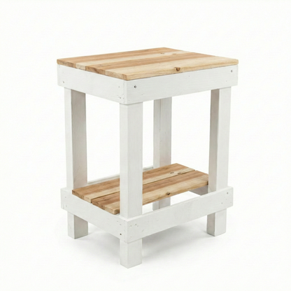 Rustic farmhouse solid wood handmade end table with open shelves and natural finish next to gray sofa.