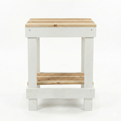 Rustic farmhouse solid wood handmade end table with open shelves and natural finish next to gray sofa.