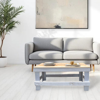White solid wood coffee table with a plank top in modern rustic furniture style.