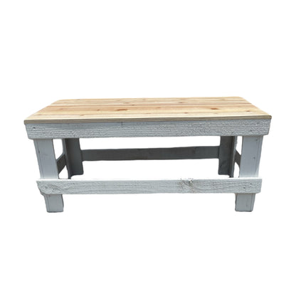 White solid wood coffee table with a plank top in modern rustic furniture style.