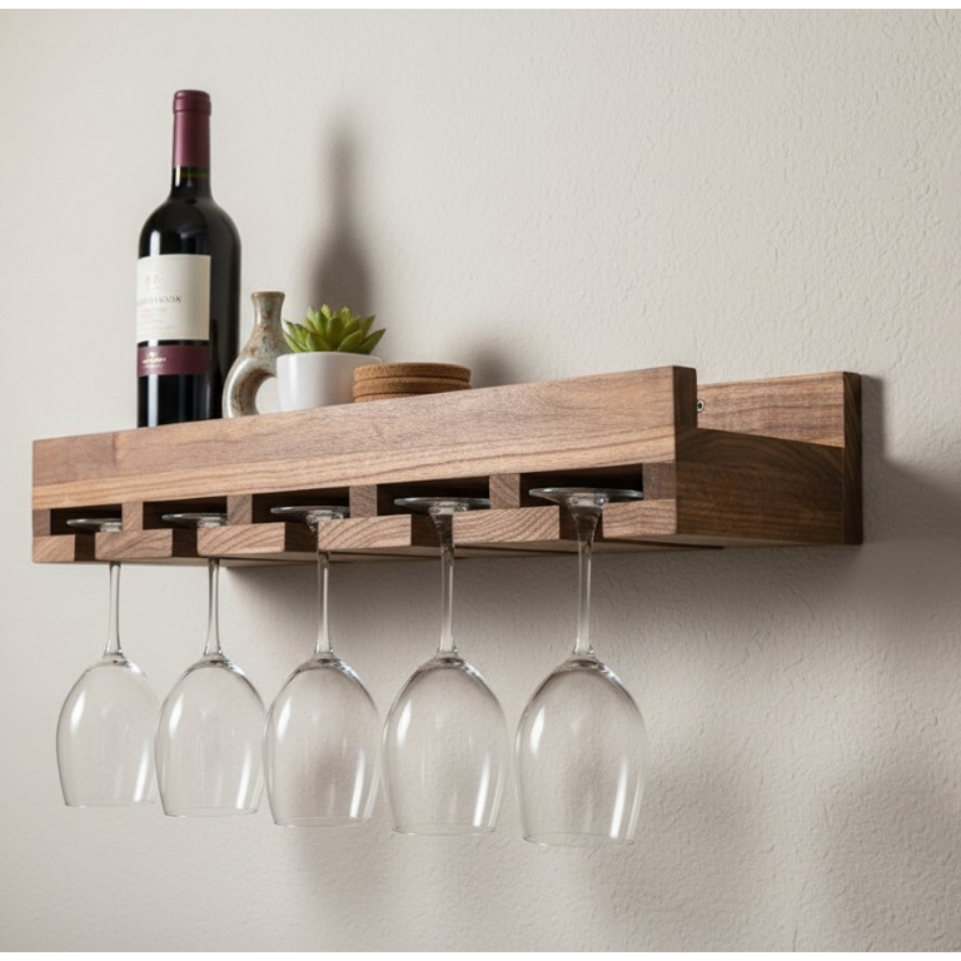Wooden wall-mounted wine rack with hanging glasses against a plain wall.
