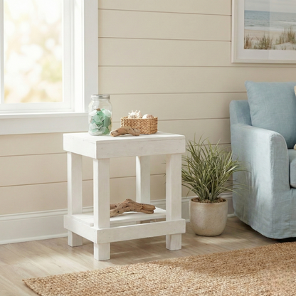 Rustic farmhouse solid wood handmade end table with open shelves and natural finish next to gray sofa.