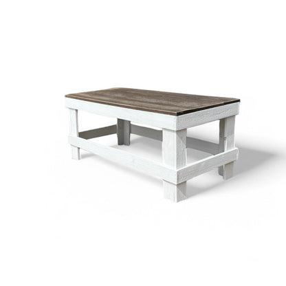 White solid wood coffee table with a plank top in modern rustic furniture style.
