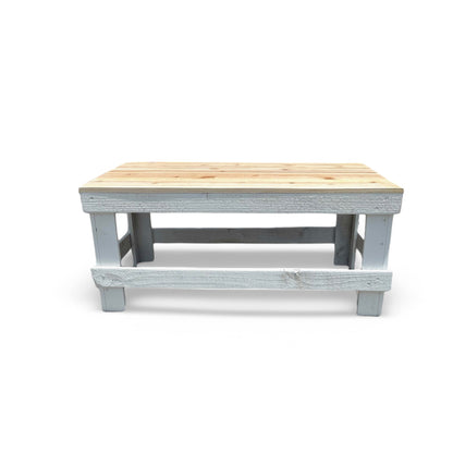 White solid wood coffee table with a plank top in modern rustic furniture style.