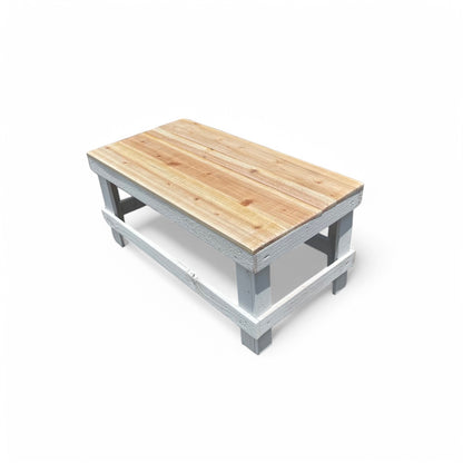 White solid wood coffee table with a plank top in modern rustic furniture style.