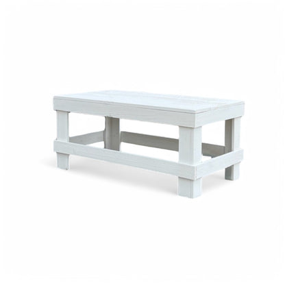 White solid wood coffee table with a plank top in modern rustic furniture style.