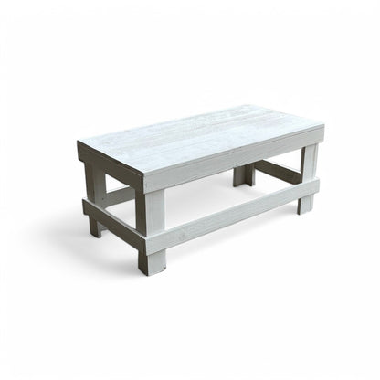 White solid wood coffee table with a plank top in modern rustic furniture style.
